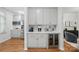 Butler pantry with white cabinets, countertop appliances, and a beverage refrigerator at 902 Hoke Trl, Cramerton, NC 28032