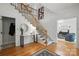 Bright foyer with hardwood floors, elegant staircase, and stylish decor creates a welcoming entrance at 902 Hoke Trl, Cramerton, NC 28032