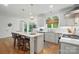 Bright kitchen features a large island with counter seating and modern stainless steel appliances at 902 Hoke Trl, Cramerton, NC 28032