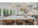Open kitchen showcases pendant lighting over the island and a lovely view of the breakfast nook at 902 Hoke Trl, Cramerton, NC 28032