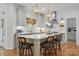 Modern kitchen with island seating, pendant lighting, and stainless steel appliances for a sleek look at 902 Hoke Trl, Cramerton, NC 28032