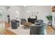 Well-decorated living room features four chairs around a coffee table and unique wall decor at 902 Hoke Trl, Cramerton, NC 28032