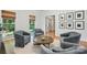 Living room with wood floors and cozy seating, perfect for relaxation or entertaining guests at 902 Hoke Trl, Cramerton, NC 28032