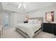 Bright main bedroom features neutral decor, recessed lighting, and ensuite bath entrance at 902 Hoke Trl, Cramerton, NC 28032