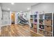 Spacious playroom with basketball hoop, laminate floors, and storage shelves at 902 Hoke Trl, Cramerton, NC 28032