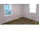Bright bedroom with hardwood floors and dual windows, offering plenty of sunlight and a pleasant view at 906 N 11Th St, Albemarle, NC 28001