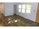 Sunlit living room with hardwood floors, offering a view of the neighborhood through the window at 906 N 11Th St, Albemarle, NC 28001