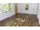 Inviting living room with hardwood floors, large windows, and freshly painted walls, creating a cozy atmosphere at 906 N 11Th St, Albemarle, NC 28001