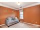Charming bedroom with a comfortable couch, decorative accents, neutral carpet and natural light at 9106 Dogwood Ridge Dr, Charlotte, NC 28227