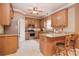 Spacious kitchen with stainless appliances, island seating, and tile backsplash at 9106 Dogwood Ridge Dr, Charlotte, NC 28227