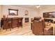 Living room with a fireplace, laminate flooring, wet bar, comfortable seating and large screen television at 9106 Dogwood Ridge Dr, Charlotte, NC 28227
