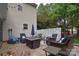 Outdoor patio with fire pit and comfortable seating perfect for entertaining guests at 9106 Dogwood Ridge Dr, Charlotte, NC 28227