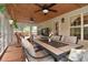Relaxing sunroom with wood ceiling and multiple windows featuring an outdoor dining area at 9106 Dogwood Ridge Dr, Charlotte, NC 28227