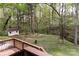 Relaxing backyard view with mature trees, shed, and natural surroundings, perfect for privacy at 948 Kingswood Dr, Rock Hill, SC 29732