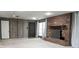 Finished basement featuring brick fireplace, neutral carpet, and ample natural light at 948 Kingswood Dr, Rock Hill, SC 29732