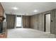 Spacious finished basement area with a brick fireplace and neutral carpet at 948 Kingswood Dr, Rock Hill, SC 29732