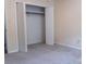 A carpeted bedroom with an open closet for organization at 948 Kingswood Dr, Rock Hill, SC 29732