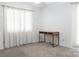 A carpeted bedroom with a desk and curtains at 948 Kingswood Dr, Rock Hill, SC 29732