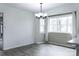 Bright dining room with ample natural light from a large window and modern chandelier at 948 Kingswood Dr, Rock Hill, SC 29732