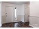 Foyer features wood flooring, wainscotting details, and a front door with sidelight at 948 Kingswood Dr, Rock Hill, SC 29732