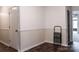 Hallway featuring hardwood floors, wainscotting, and access to multiple rooms at 948 Kingswood Dr, Rock Hill, SC 29732