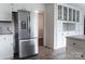 Kitchen boasts stainless steel refrigerator, white cabinets, and modern recessed lighting at 948 Kingswood Dr, Rock Hill, SC 29732