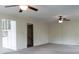 Spacious living room with neutral carpet, two ceiling fans, and access to the kitchen and stairs at 948 Kingswood Dr, Rock Hill, SC 29732