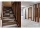 Carpeted stairs with natural wood accents in finished basement at 948 Kingswood Dr, Rock Hill, SC 29732