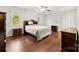 Spacious bedroom featuring wood floors, large windows, and plenty of natural light at 1012 Woodlark Ct, Gastonia, NC 28056