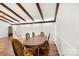 Bright dining area features wood floors and exposed beams, ideal for entertaining at 1012 Woodlark Ct, Gastonia, NC 28056