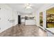 Open kitchen with white cabinetry, modern appliances, and access to a deck at 1012 Woodlark Ct, Gastonia, NC 28056
