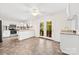 Bright kitchen with white cabinets, island, and access to a wood deck at 1012 Woodlark Ct, Gastonia, NC 28056
