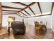 Spacious living room features beamed ceiling, brick fireplace and hardwood floors at 1012 Woodlark Ct, Gastonia, NC 28056