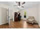 Bright home office with wood floors, floral chair, and a window view at 1012 Woodlark Ct, Gastonia, NC 28056
