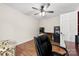 Office featuring wood floors, a ceiling fan, and a black leather chair at 1012 Woodlark Ct, Gastonia, NC 28056