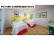 Charming bedroom featuring two twin beds with bright yellow headboards and colorful accents at 103 Way Cross Ln, Troutman, NC 28166