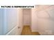 Walk-in closet with carpet flooring and shelving for optimal storage at 103 Way Cross Ln, Troutman, NC 28166