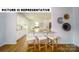 Bright kitchen with a breakfast bar, modern appliances, and easy access to the dining area and living spaces at 103 Way Cross Ln, Troutman, NC 28166