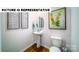 Tastefully decorated powder room featuring wood look flooring, pedestal sink, and neutral walls at 103 Way Cross Ln, Troutman, NC 28166