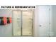 Clean shower stall featuring built-in shelving and a sliding glass door at 103 Way Cross Ln, Troutman, NC 28166