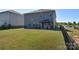 Large backyard with lush lawn, privacy fence, and a covered patio at 11616 Solstice Way, Huntersville, NC 28078