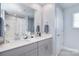 Modern bathroom with double vanity, large mirror, and clean, neutral tones at 11616 Solstice Way, Huntersville, NC 28078