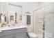 Bathroom featuring a vanity with modern fixtures and a glass-enclosed shower at 11616 Solstice Way, Huntersville, NC 28078