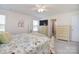 Airy bedroom with a king-size bed, stylish dresser, and a calming neutral palette at 11616 Solstice Way, Huntersville, NC 28078