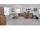 Spacious bonus room featuring two work stations, natural light, and neutral carpeting at 11616 Solstice Way, Huntersville, NC 28078