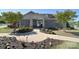 Charming gray clubhouse with a landscaped walkway and well-maintained flower beds at 11616 Solstice Way, Huntersville, NC 28078