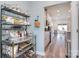Hallway view into the kitchen, showcasing open layout and decorative shelving at 11616 Solstice Way, Huntersville, NC 28078