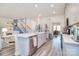 Spacious kitchen with white cabinets, large island, and stainless steel appliances at 11616 Solstice Way, Huntersville, NC 28078