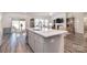 Open-concept kitchen flows into the living area, creating a spacious and inviting atmosphere at 11616 Solstice Way, Huntersville, NC 28078