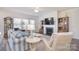 Comfortable living room featuring a fireplace, TV, neutral colors, and plenty of seating at 11616 Solstice Way, Huntersville, NC 28078
